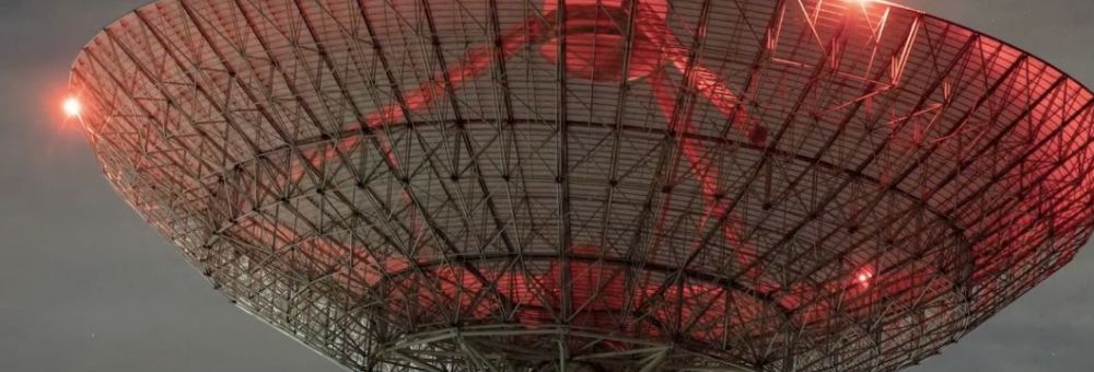 Satellite dish with a red hue